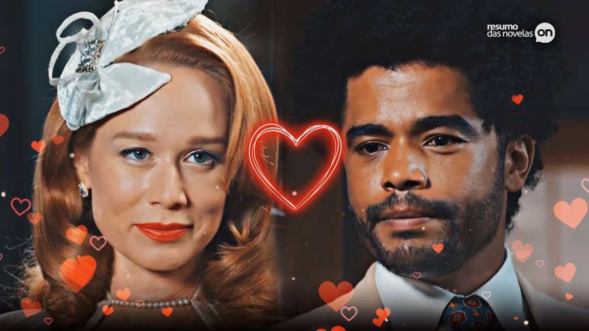 Gilda e Orlando se olhando, com corações ao redor deles na novela Amor Perfeito